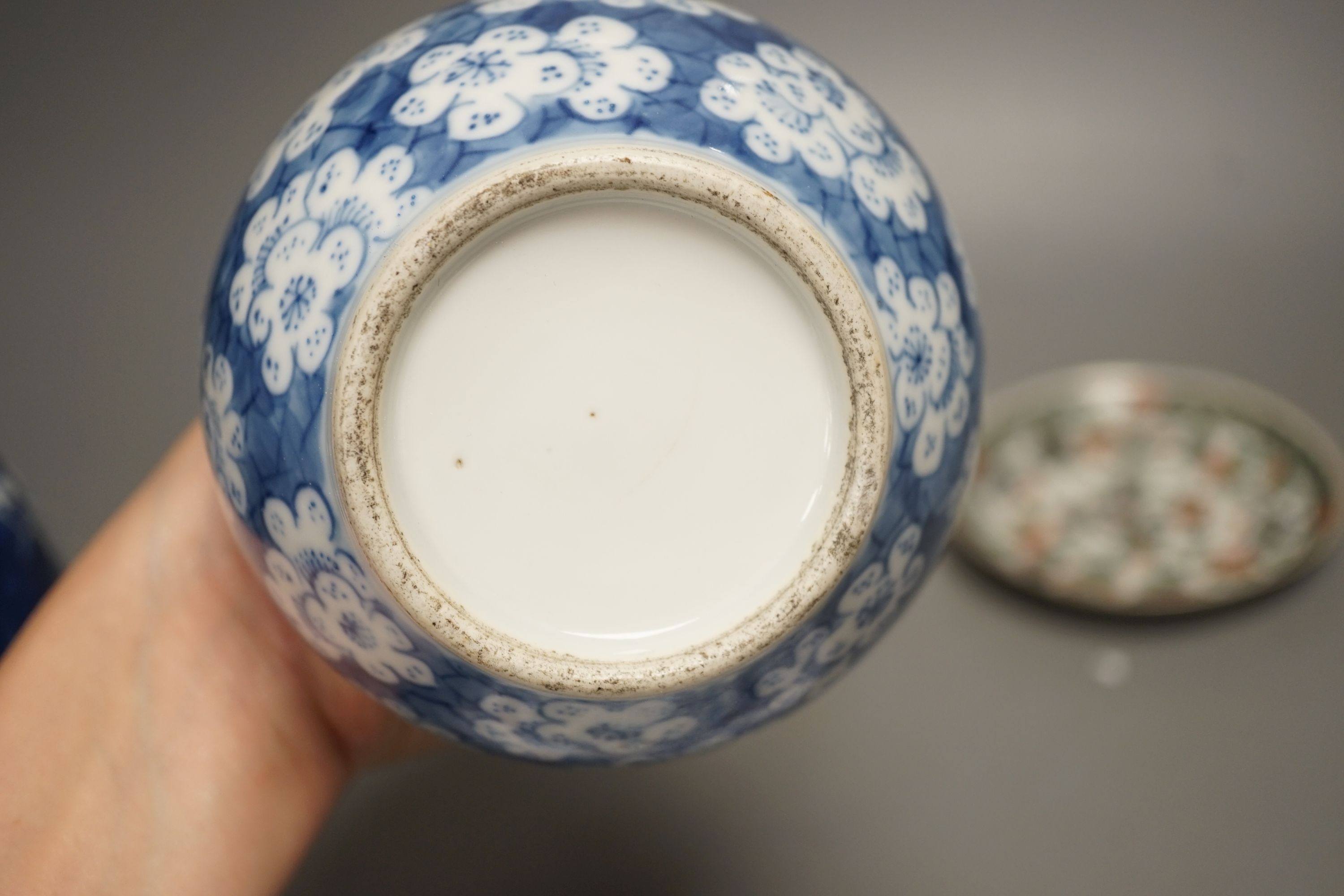 A Chinese blue and white jar, a similar vase, a polychrome plate and a famille verte saucer- plate 25 cms diameter.